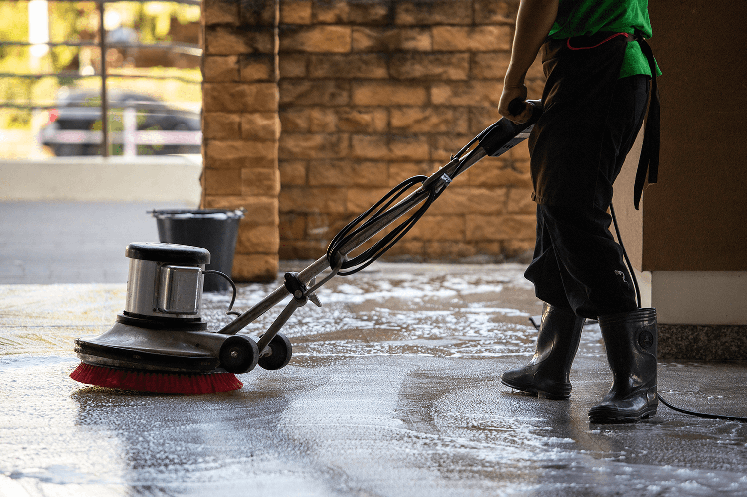 A cleaner using a floor polishing machine