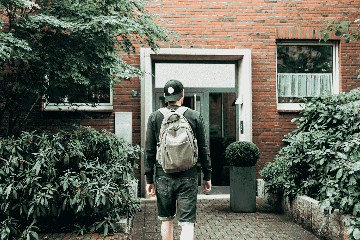 a student walking to the front door of their accomodation block[1]-min